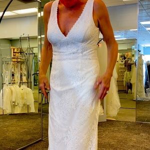 Brand new never used wedding dress..long story but I never wore it.